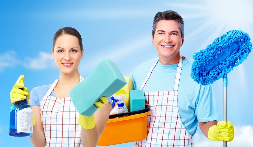 Professional cleaning team confirming booking details and scope